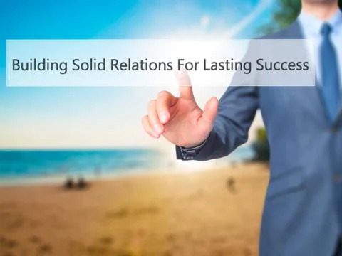 Building Solid Relations For Lasting Success -  Businessman click on virtual  Fotos de archivo
