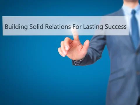 Building Solid Relations For Lasting Success -  Businessman click on virtual  Fotos de archivo