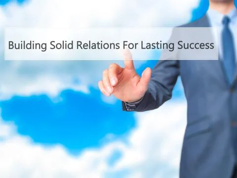 Building Solid Relations For Lasting Success -  Businessman click on virtual  Fotos de archivo