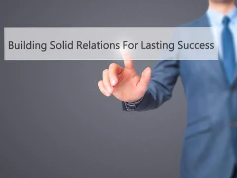 Building Solid Relations For Lasting Success -  Businessman click on virtual  Fotos de archivo