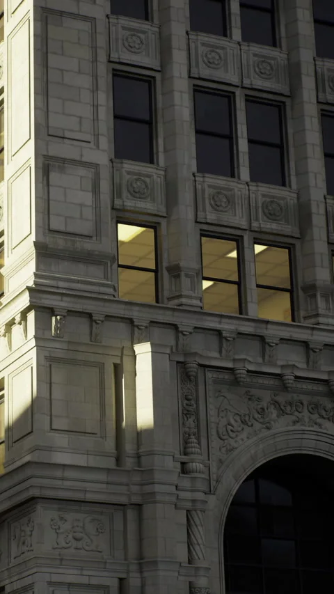 Building with stone facade and windows at evening light in urban area Stock Footage 335236929