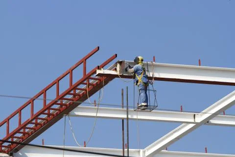 Building structure and working man Stock Photos