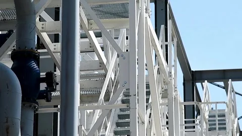 A building structure made of metal beams forming the frame of a building or.. Vídeos de archivo 331205913