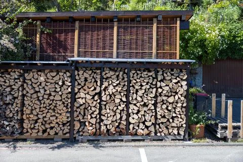 Building structure with sliced logs in a park Fotos de archivo