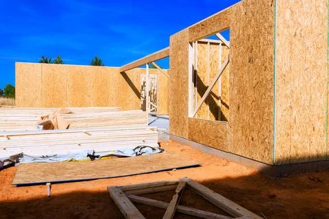 Building structure with wooden elements under framework construction site Stock Photos