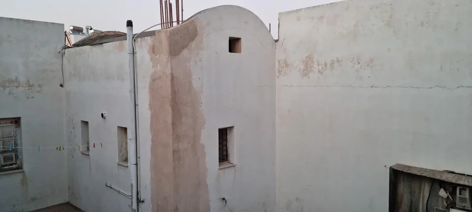 Building structures in a small area during the evening with light fading in.. Stock Photos