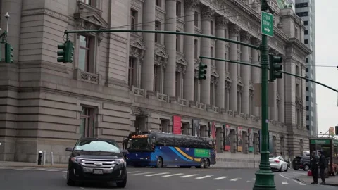 Building Surrounded by Traffic Flow and Green Traffic Lights in Urban Setting 스톡 동영상 291639579