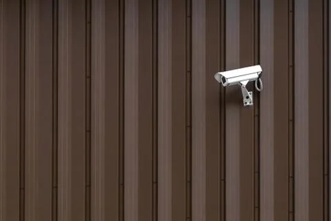 Building with Surveillance or Security Camera on metal brown wall, corrugated Photos
