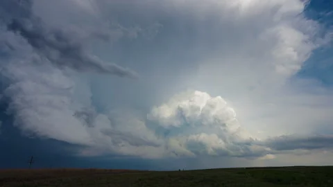 Building thunderstorm clouds growing and moving across dramatic sky Stock-Footage 338172221