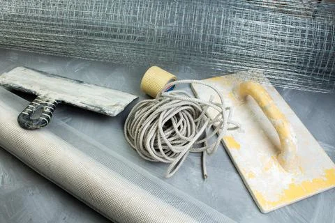 Building tools on the gray concrete background. Copy space. Top view. Stock Photos