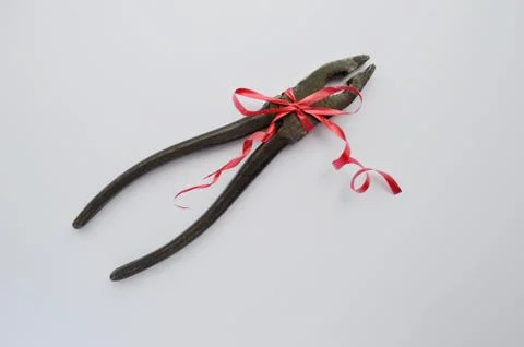 Building tools with a red bow on a white background. fathers day. Labor Day Stock Photos