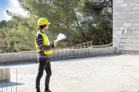 Building training, apprentice engineer on a construction site of house Stock Photos