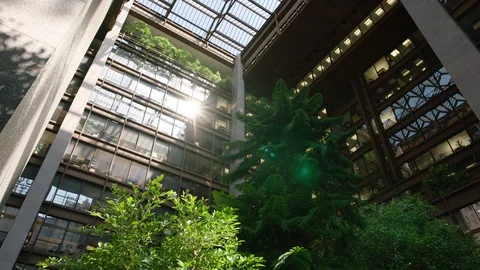 Building with trees at high floor, quarter angle pan Stock Footage 110185901