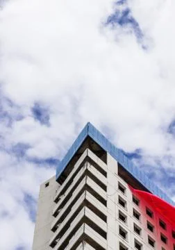 Building triangle and cloudy sky Stock Photos