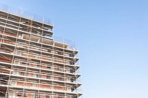 Building under construction with building armor. Stock Photos
