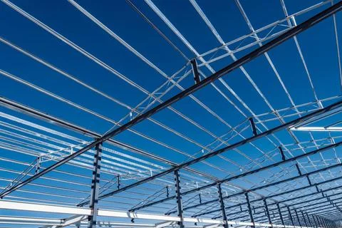 Building under construction. Building under construction on the blue sky b... Fotos de archivo