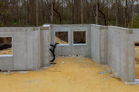 Building under construction in the cement foundation of a new housing develop Foto stock