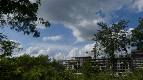 The building is under construction, the clouds are moving in the background. 스톡 동영상 97338286
