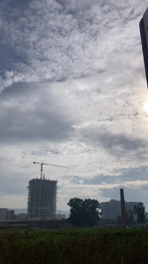 Building Under Construction on a Cloudy Day (Vertical) Stock Footage 301606024