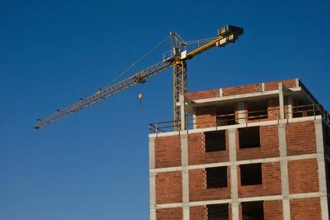 Building under construction with a crane mounted, building, civil construction Stock Photos