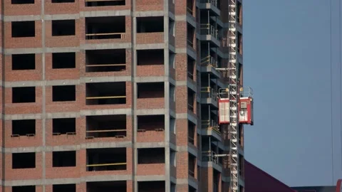 Building under construction with an elevator lift. Stock Footage 194971435