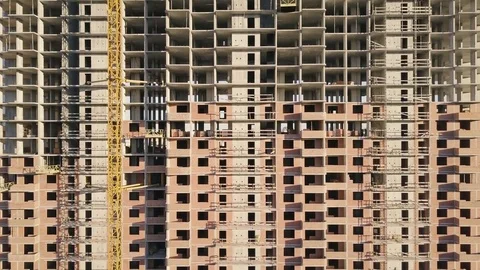 Building under construction. A multi-storey residential building. The camera is Stock Footage 76318196