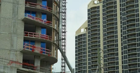 Building under construction parallax motion shot with telephoto lens Vídeo Stock 143299540