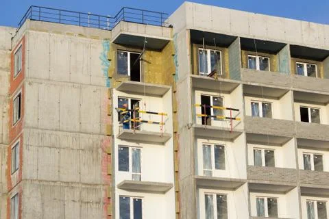 Building under construction in scaffolding Stock Photos