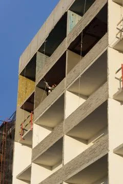 Building under construction in scaffolding Stock Photos