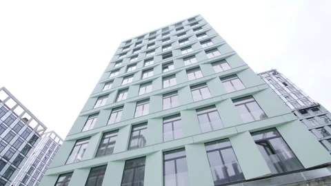 Building under construction shows finished facade cladding Stock Footage 330217479