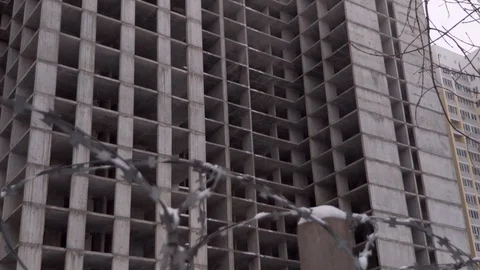 Building under construction in snowfall Stock Footage 129521655