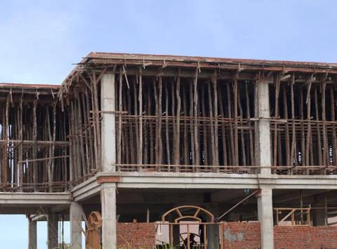 BUILDING UNDER CONSTRUCTION WITH SUPPORTING TIMBERS Stock Photos