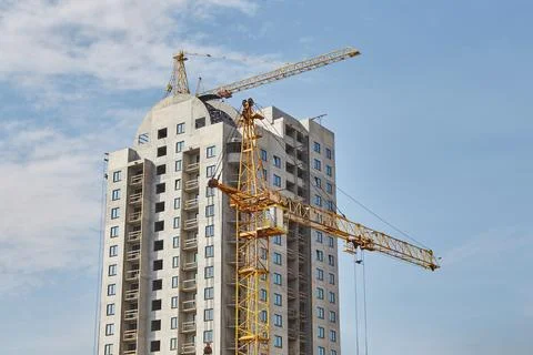 Building under construction with tower cranes. 库存照片