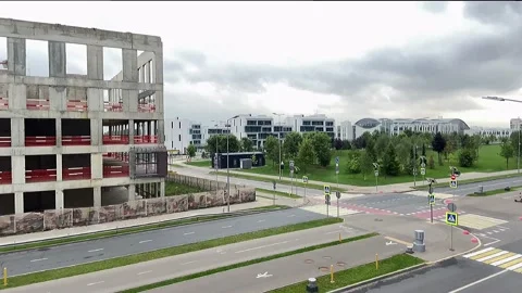 Building under construction working crane driving big trucks concrete mixer Stock Footage 159709458