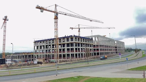 Building under construction working crane driving big trucks concrete mixer Stock Footage 159709470