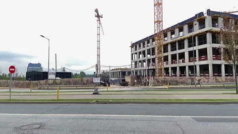 Building under construction working crane driving big trucks concrete mixer Stock Footage 159709485