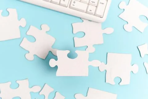 Building An Unfinished White Jigsaw Pattern Puzzle With Missing Last Piece Stock Photos