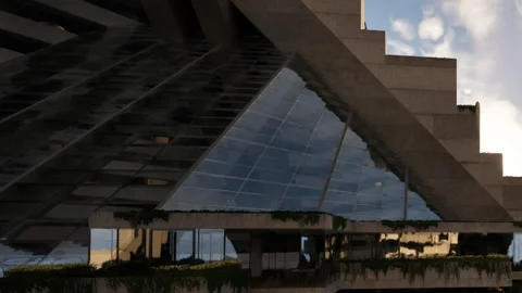 Building with unique design and large glass surfaces in urban area Video stock 344553417