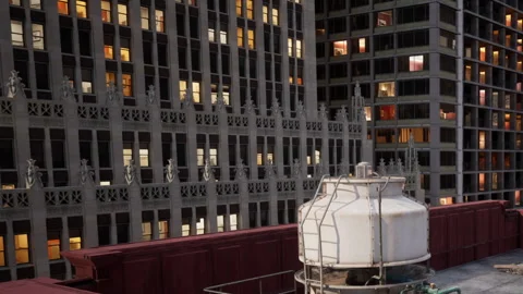 Building views from a rooftop with water tank and city buildings nearby Vídeos de archivo 344408911