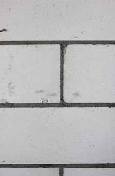 The building wall background. The grey bricks of the cement basis Stock Photos