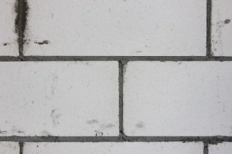 The building wall background. Grey bricks, cement. Stock Photos