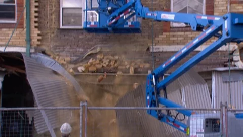 Building wall collapses during construction work Stock Footage 93017961
