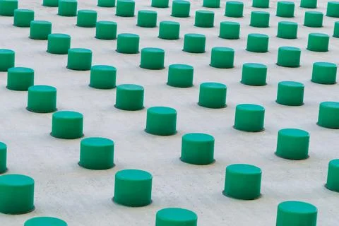 Building wall element with green plastic cones close up 库存照片