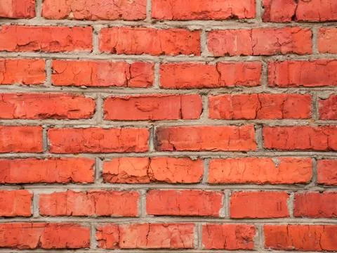 Building wall of red brick. Brickwork. Textured background Фото