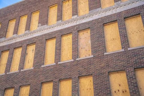 Building wall with red bricks and windows with wood panels- San Antonio, Texa Fotos de archivo