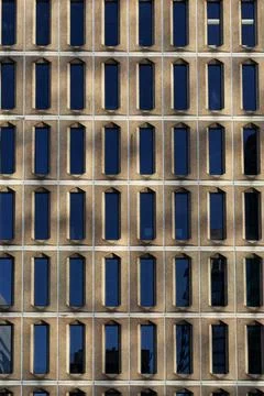 Building wall with windows abstract background Stock Photos