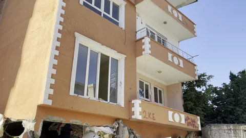 A building whose ground floor collapsed in an earthquake Stock Footage 246459787