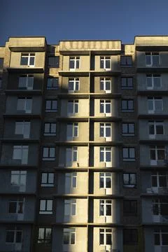 Building with windows. Urban development. Lots of apartment building. Stock Photos