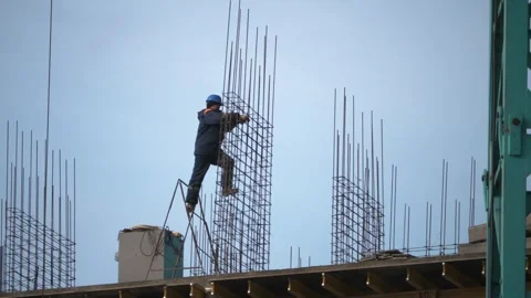 Building workers are constructing a metal framework. Construction. Stock Footage 321004062