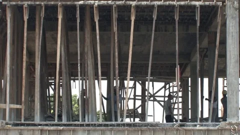 Building workers behind beams Video stock 80461936